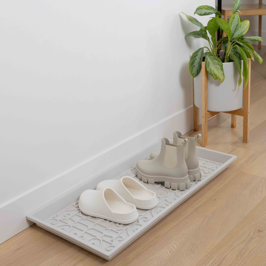 shoes on a white boot tray